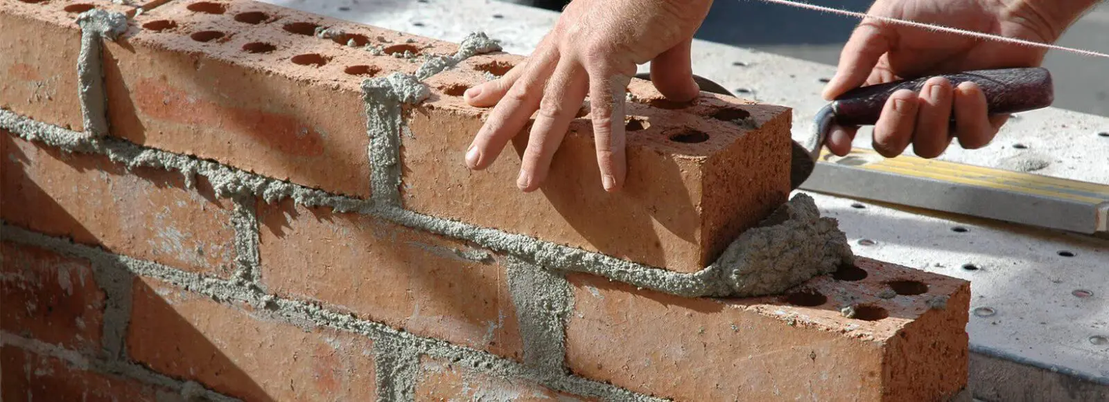 Common render bricks being laid during construction