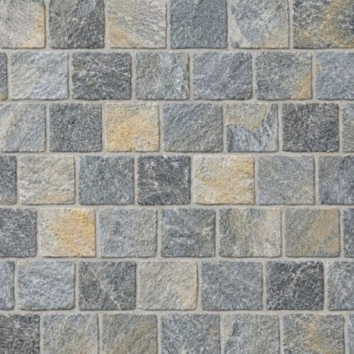 Denim Blue Quartz Cobblestone Pavers showing blue-grey, charcoal and warm-toned textured cobbles in offset rows