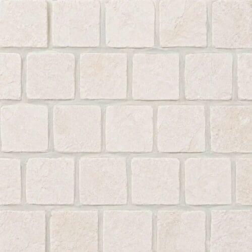 Light Cream Limestone Cobblestone Pavers showing light cream cobbles with subtle surface markings in offset rows