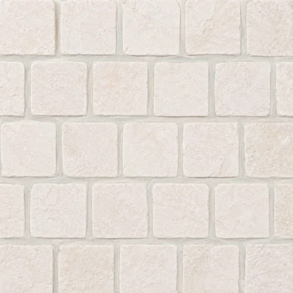 Light Cream Limestone Cobblestone Pavers showing light cream cobbles with subtle surface markings in offset rows